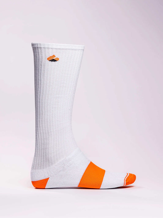 White and orange compression socks with targeted support for athletes.